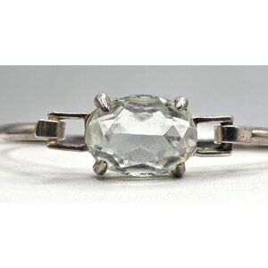 Silver Tone Bracelet With Oval-Cut Clear Glass Center Open Hinged Design